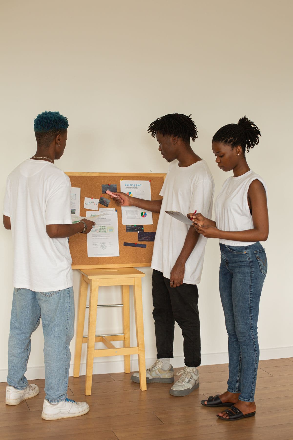 Young people collaborating around a civic workshop board